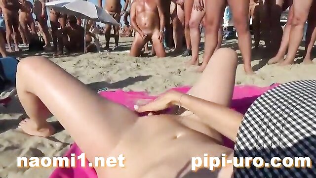 girl masturbates on the beach